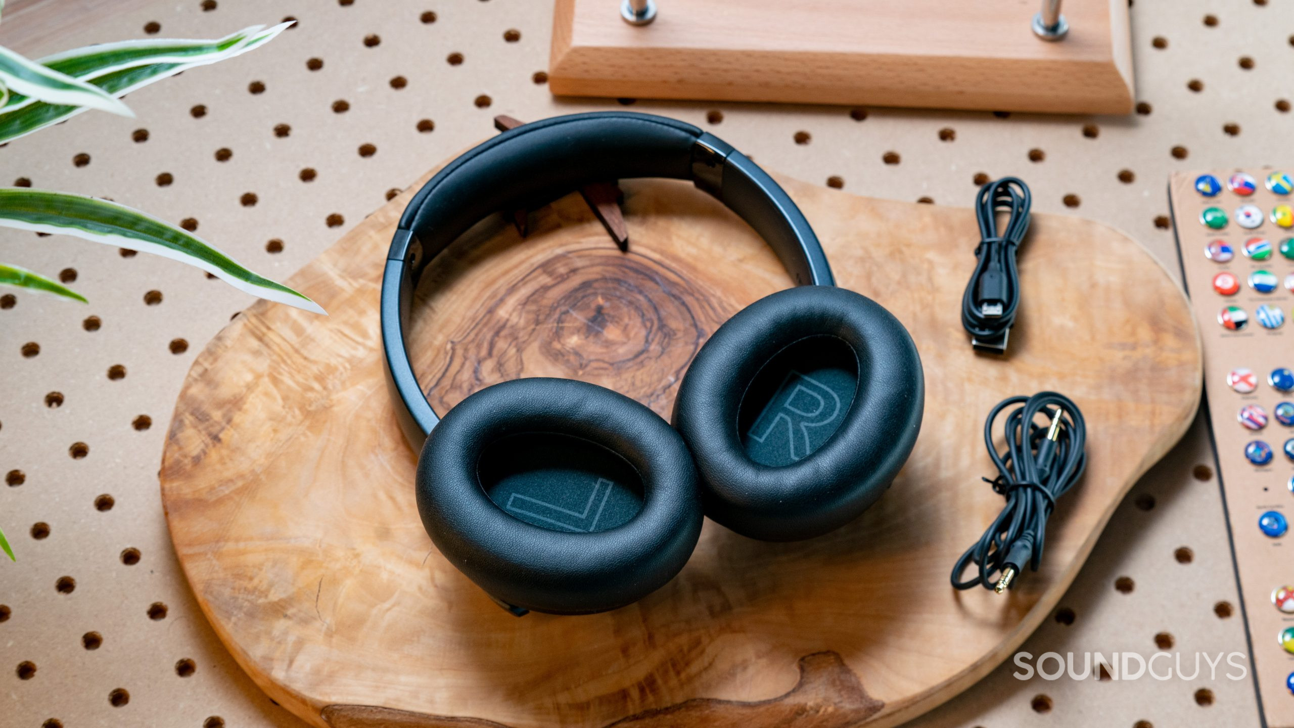 The Anker Soundcore Life Q20 headset in full with the ear cups facing upward while resting on a wood surface.