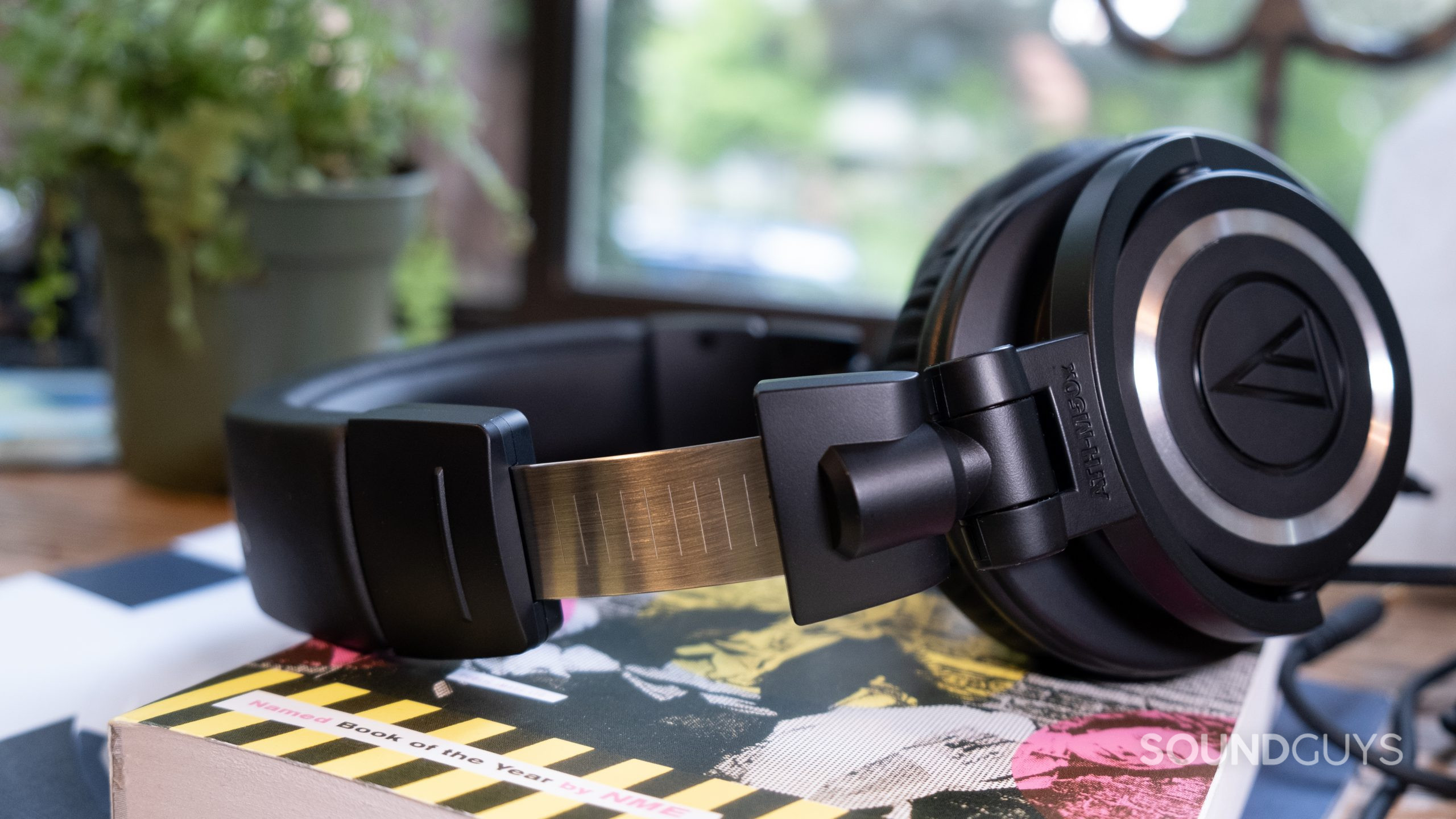 The Audio-Technica ATH-M50x from the side with the headband expanded to show the metal notches.