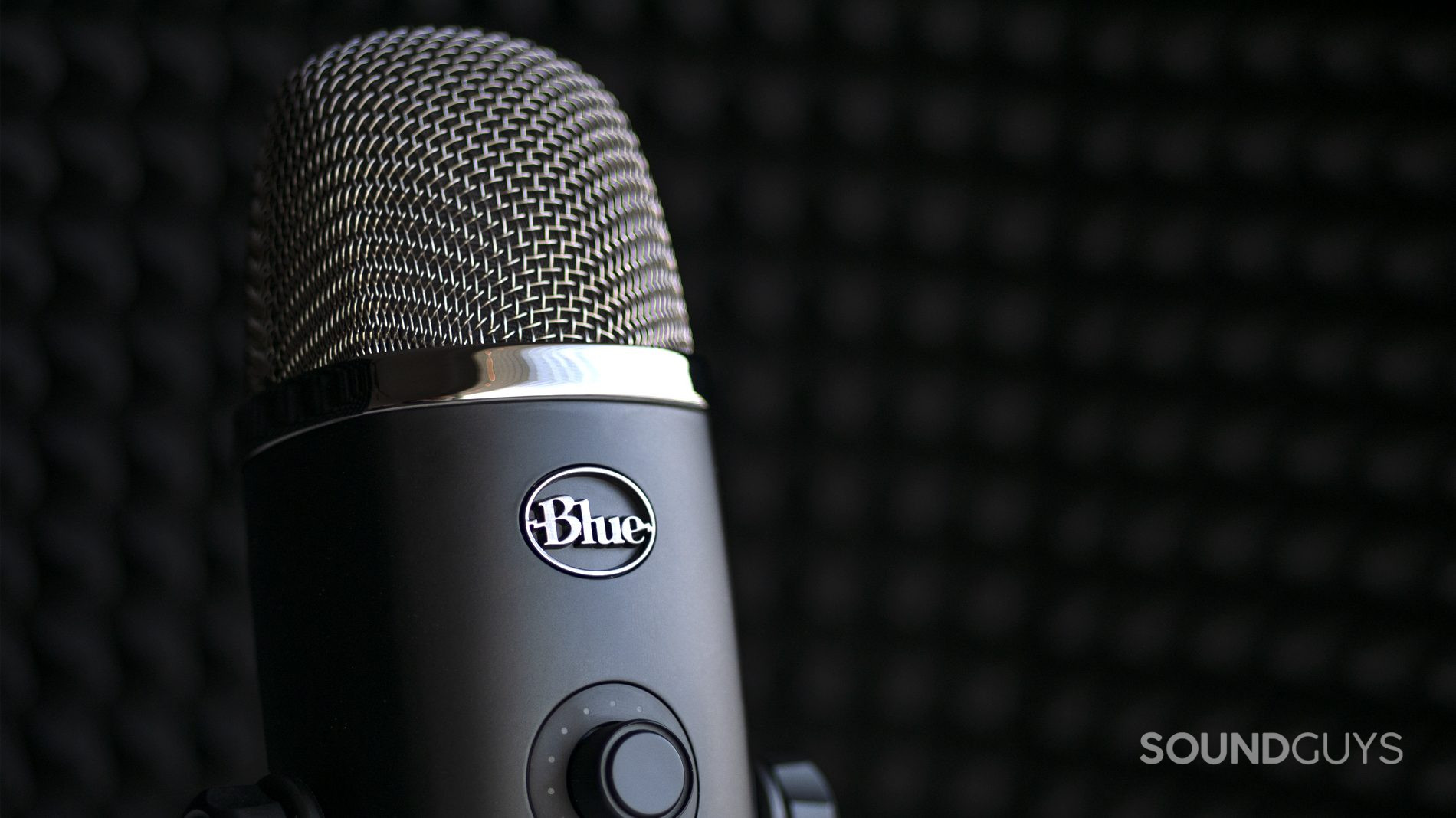 The Blue Microphones Yeti X in front of sound dampening material.