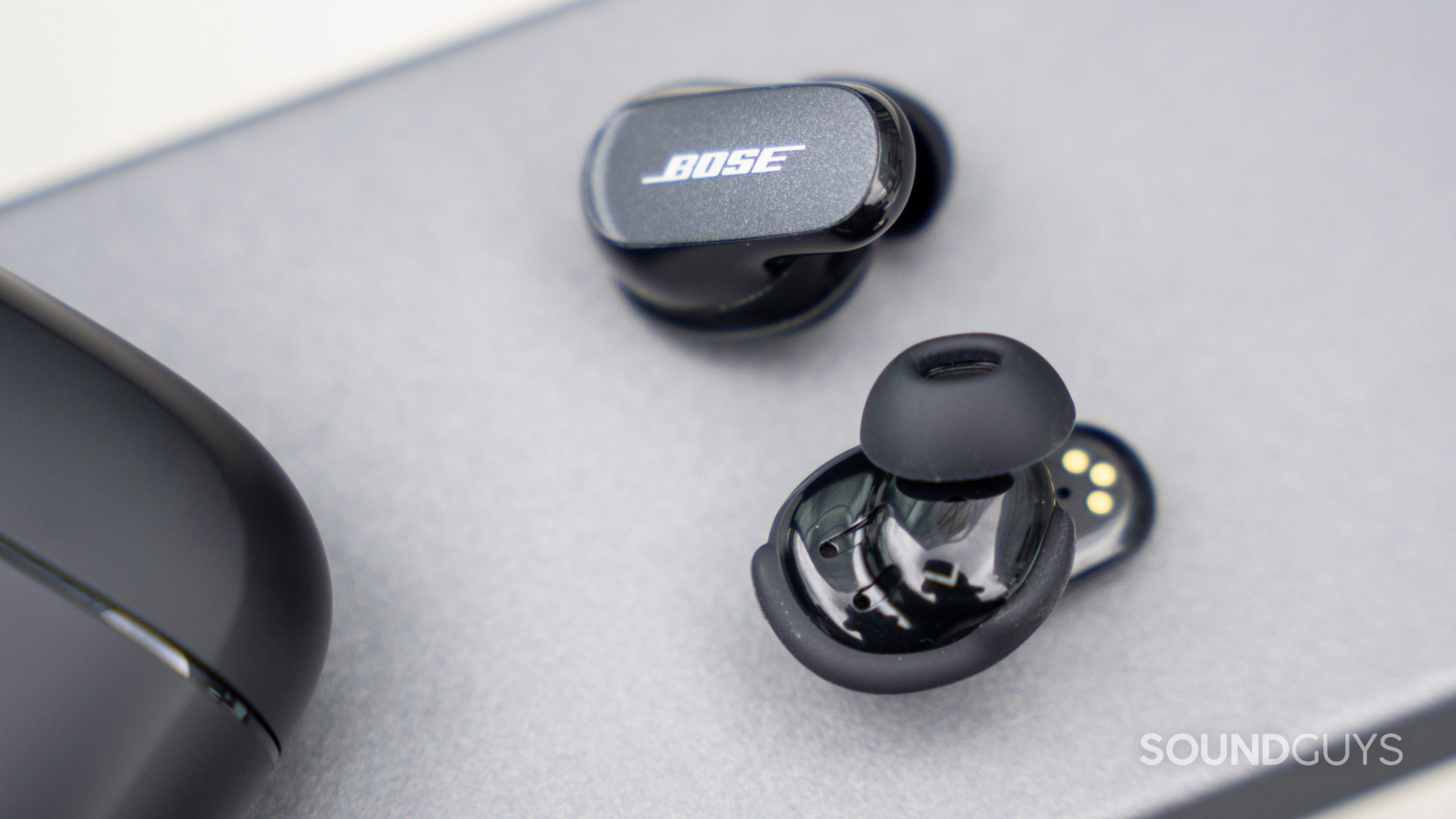The Bose QuietComfort Earbuds II with the concha ear wings and oblong ear tips.