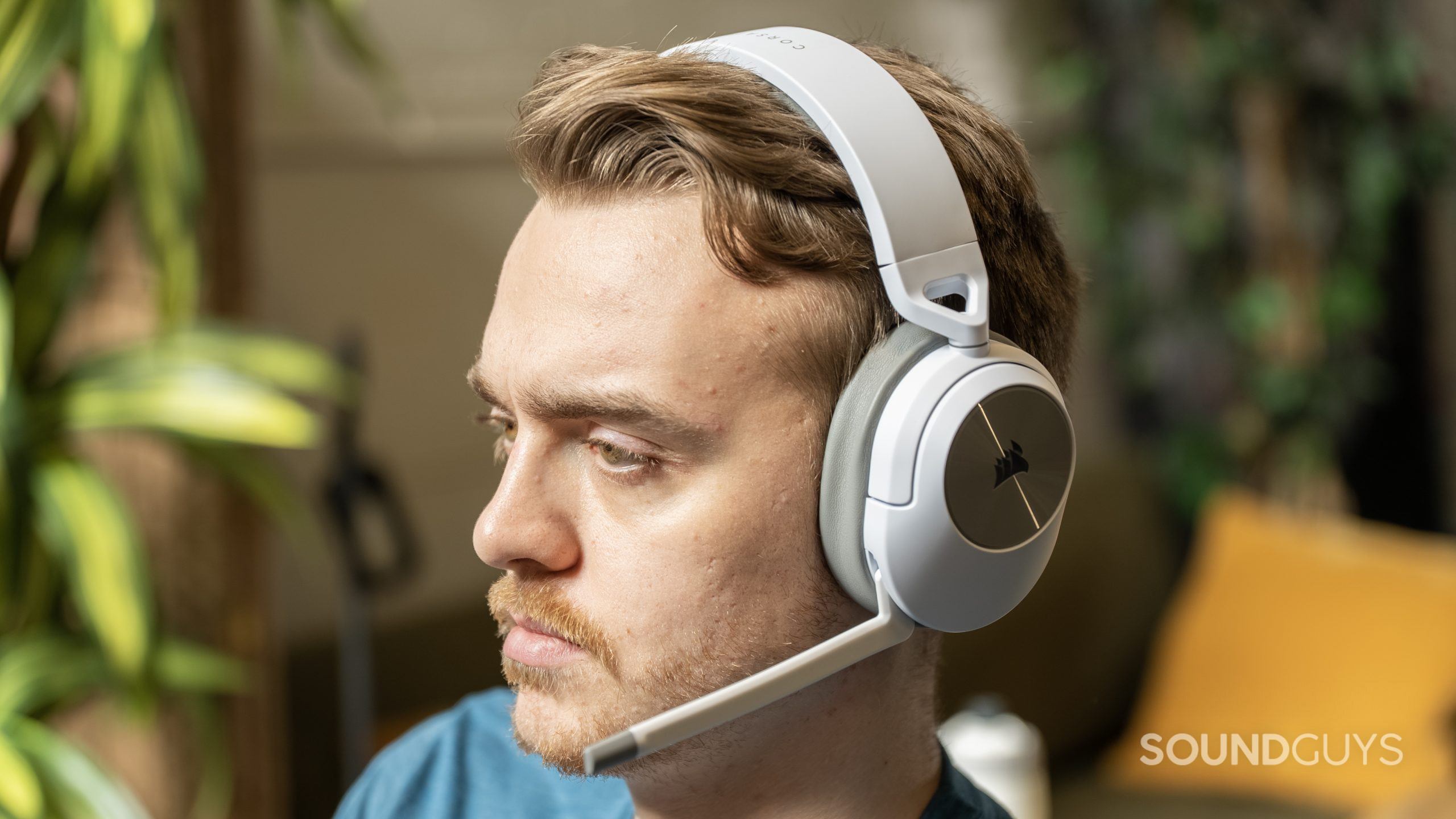 A person wearing the Corsair HS55 Wireless.
