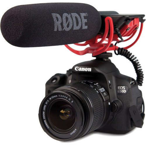 Rode VideoMic attached to DSLR camera against white background.